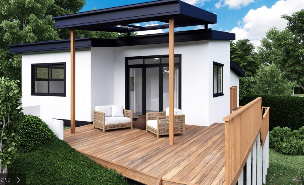 Modern white granny flat with timber deck, outdoor seating area, flat roof and large windows in leafy backyard