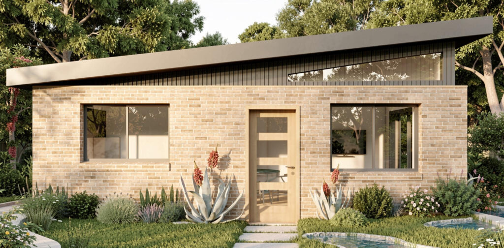 Modern single-story granny flat with brick exterior, large windows, and landscaped garden in Sydney backyard setting