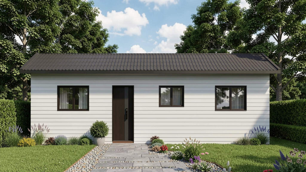 Modern white granny flat with grey roof and landscaped garden featuring stone pathway and native plants