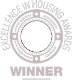 Excellence in Housing Award Winner circular badge with decorative border design